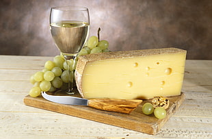 cheese, grapes, wine glass, and knife on wooden board HD wallpaper